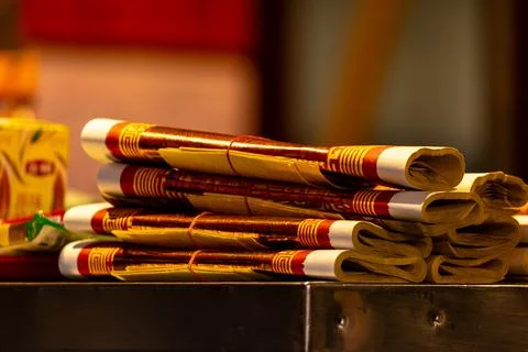 Rolled Joss Paper on Offering Supply Table Stock Photos