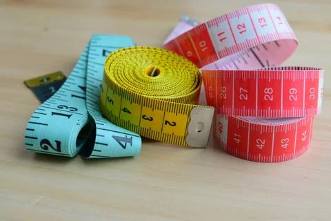 Rolled up measuring tapes Stock Photos