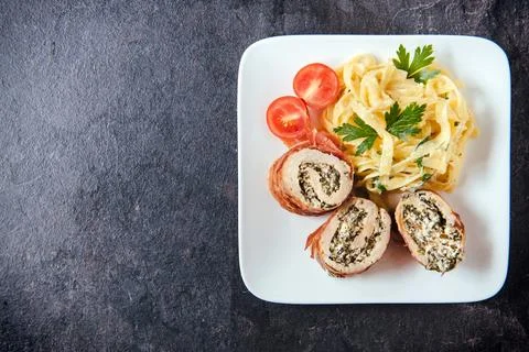 Rolled meat and spaghetti Stock Photos