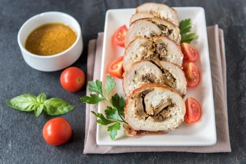 Rolled meat with champignons Stock Photos