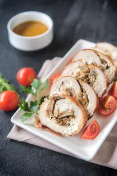 Rolled meat with champignons Stock Photos