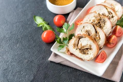 Rolled meat with champignons Stock Photos