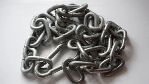 Rolled metal chain on the surface 写真素材