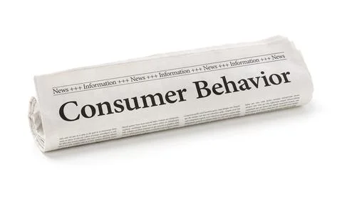 Rolled newspaper with the headline Consumer Behavior 스톡 사진