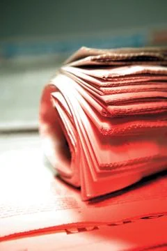 Rolled  newspaper Stock Photos