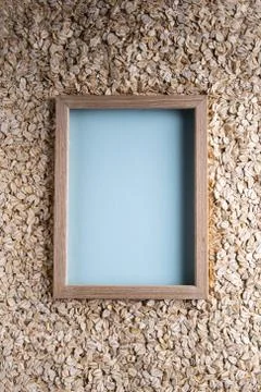 Rolled oats background with copy space in frame Stock Photos