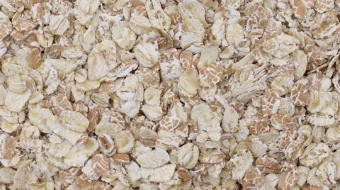 Rolled oats grains close up . Loop rotation Stock Footage 63749938