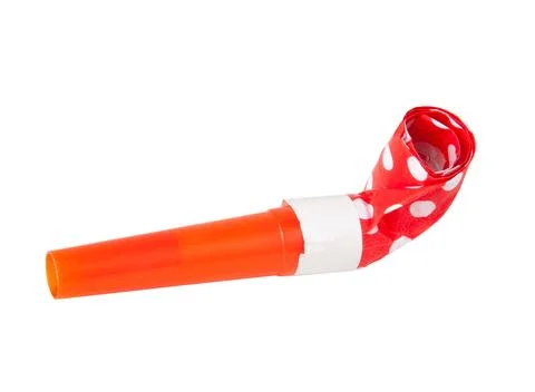 Rolled orange festive noisemaker or party whistle horn on the white isolated Stock Photos
