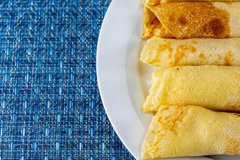 Rolled pancakes served at the table Stock-Fotos