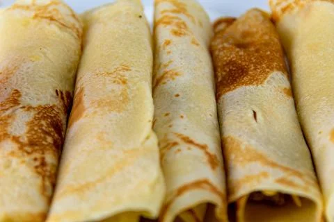 Rolled pancakes served at the table Stockfoto's