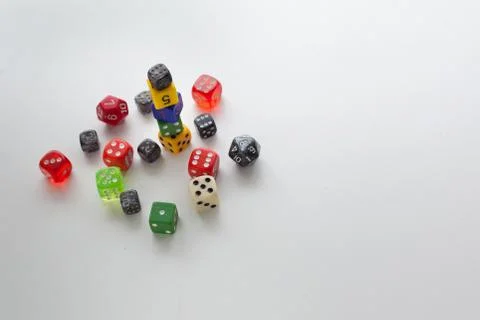Rolled playing dice multi colored Stock Photos