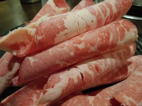 ROLLED RED BEEF MEAT STRIPS FOR KOREAN BARBECUE GRILL. SAMGYEOPSAL. Stock Photos