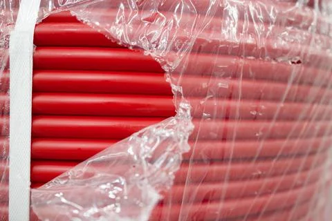 Rolled red hose texture background . Selective focus Stock Photos