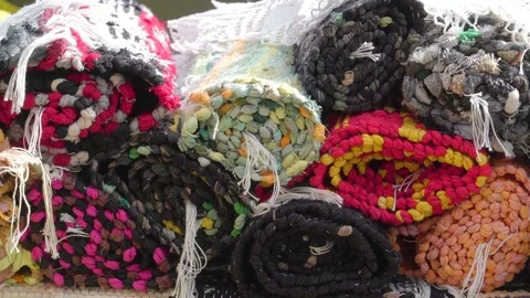 Rolled rugs with different colors in display Stock Footage 97035759