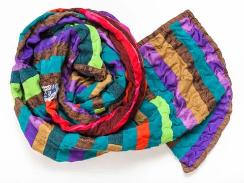 Rolled stitched patchwork scarf from silk bands Stock Photos