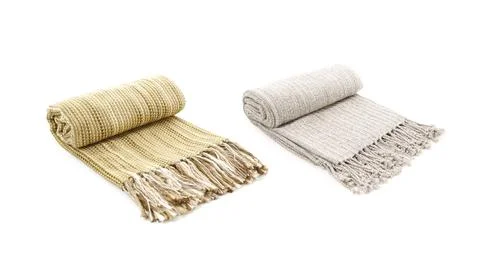 Rolled Two wool beige and yellow blankets isolated on white background Stock Photos
