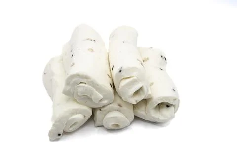 Rolled white cheese pieces isolated on white background dairy snack concept Stock Photos