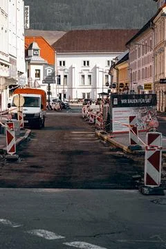 Roller and workers on asphalting and repair of city streets Stock Photos
