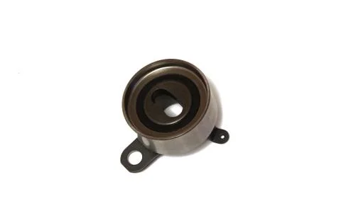 The roller in an automobile engine on a white background Stock Photos