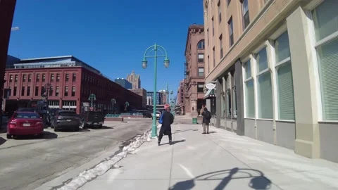 Roller blader through city street Stock Footage 237027778
