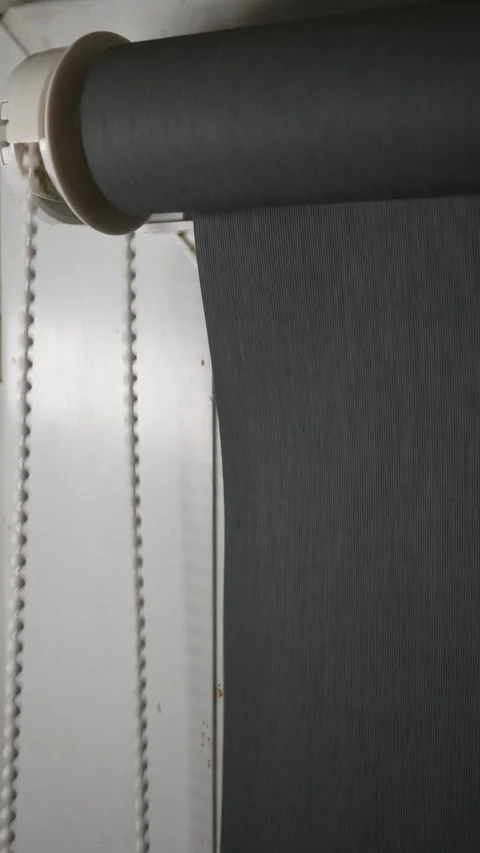 Roller blind mechanism indoors opens window,Close up. Stock Footage 297200770