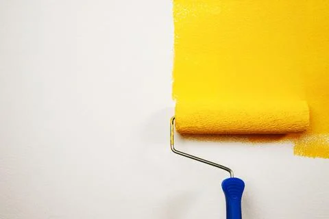 Roller Brush Painting, Worker on surface wall apartment, renovating with ye.. Stock Photos