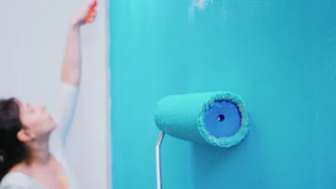 Roller brush on wall Video stock 133626097