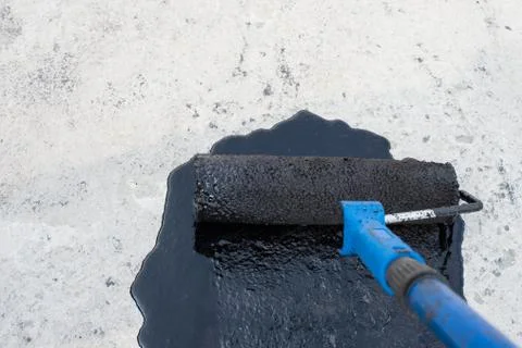 Roller brush, waterproofing Stock Photos