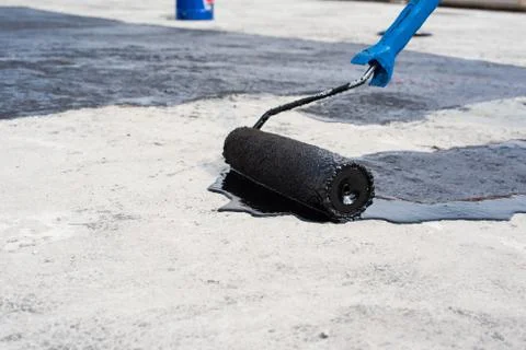 Roller brush, waterproofing Stock Photos