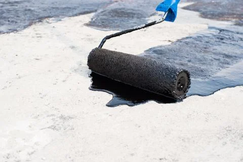Roller brush, waterproofing Stock Photos