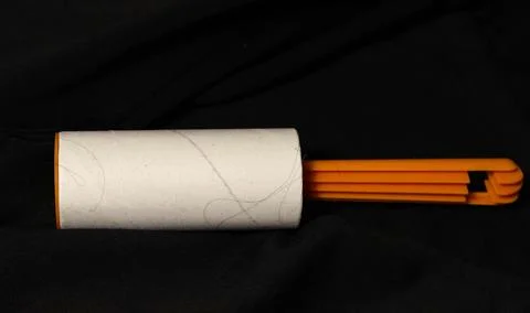 Roller for cleaning clothes with a sticky surface in the trash. Foto stock