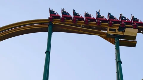 Roller coaster in an amusement park. Evening video footage in full hd format Stock Footage 88259872