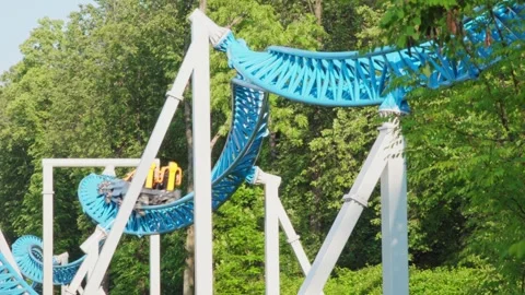 Roller coaster in the amusement park Stock Footage 312910696