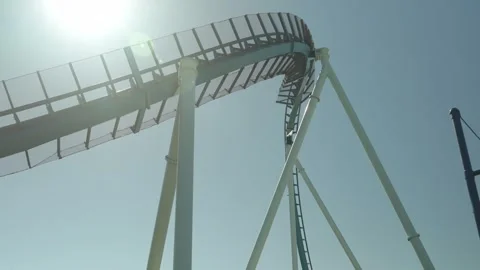 Roller Coaster Ascent Under the Bright Sun 스톡 동영상 309947697