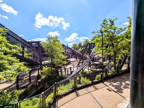 Roller Coaster Attractions At A Theme Park On A Sunny Day Stock Photos