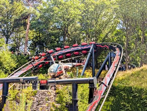 Roller Coaster Attractions At A Theme Park On A Sunny Day Stock Photos