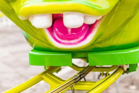 Roller coaster with caterpillar-shaped train roller coaster with green cat... Stock Photos