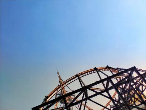 A roller coaster with a clear blue sky in the background. Stock Photos