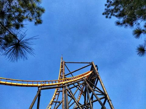 A roller coaster with a clear blue sky in the background. Stock Photos