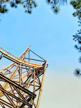 A roller coaster with a clear blue sky in the background. Stock Photos