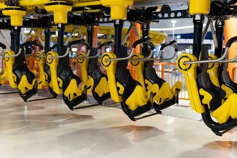 Roller coaster with empty seat parking inside the station in the amusement park Stock Photos