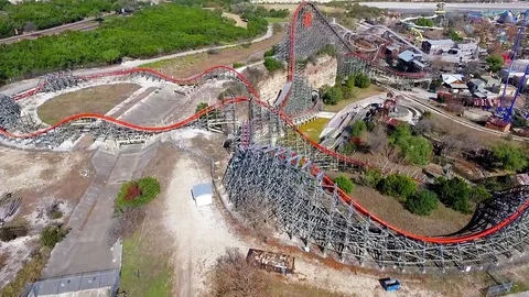 Roller coaster excitment at six flags brings thousands of visitors each year Stock Footage