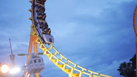 Roller Coaster in fun extreme amusement park at night Stock Footage 149043067