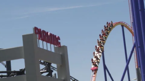 Roller Coaster going through a series of hills Stock Footage 63957664