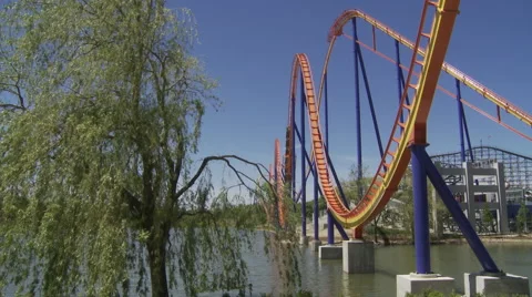 Roller Coaster going through a series of hills Stock Footage 63959511