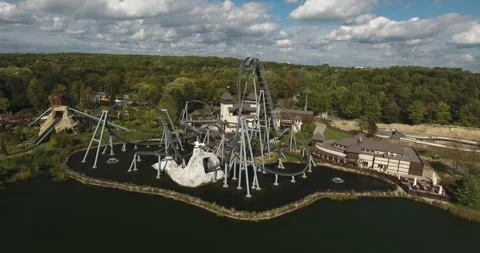 Roller coaster in a joyful amusement park located in a city park in Poland Vídeo Stock 245286675
