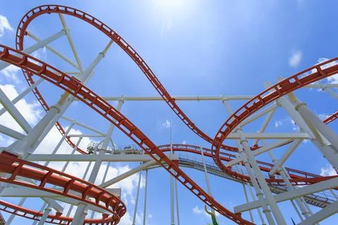 Roller coaster lines in blue sky Stock Photos
