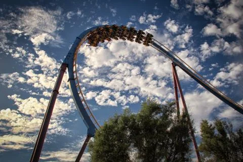 Roller coaster loop with a background of beautiful cloudy sky Foto stock