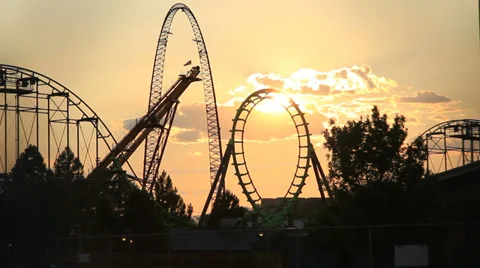 Roller coaster loop through sunset Video stock 39110024