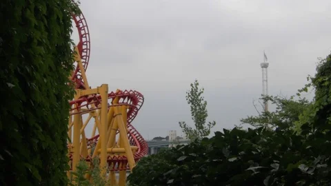 Roller-coaster looping on his track on a cloudy day. Stock Footage 92558112